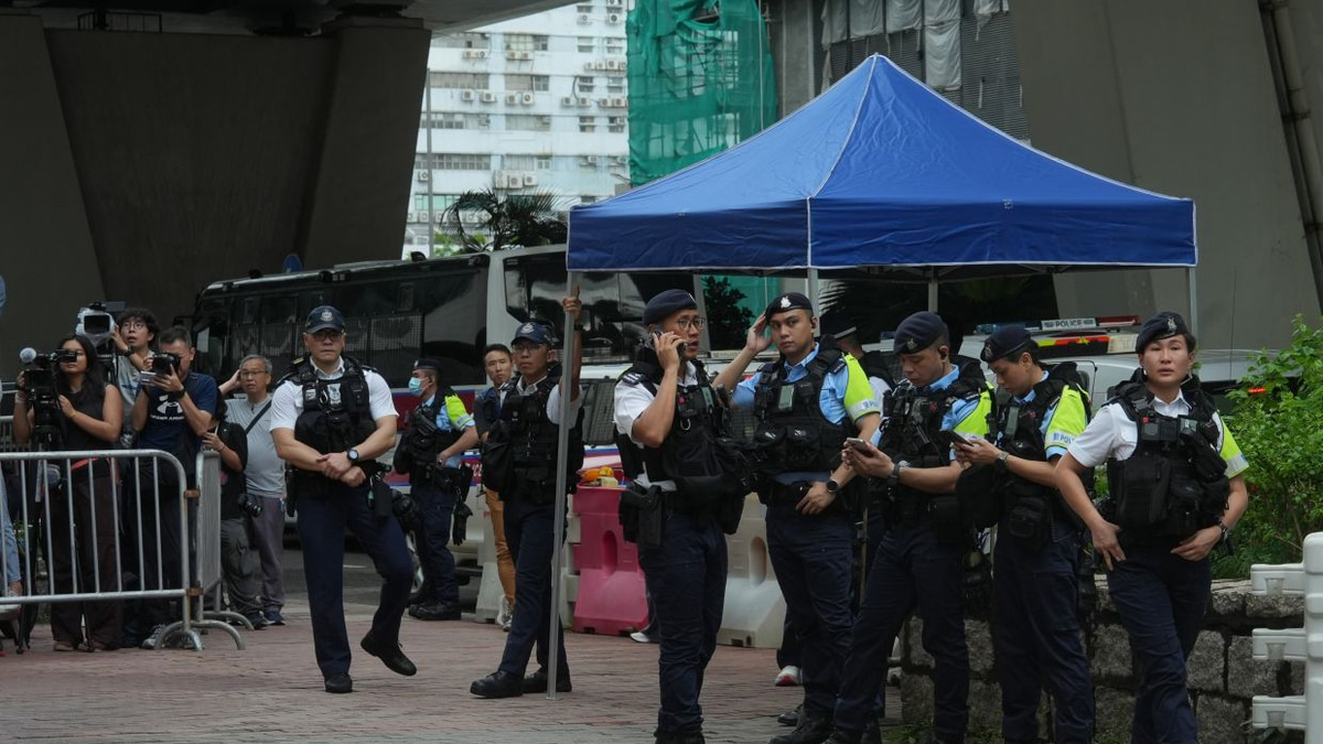 Hong Kong arrests woman over T-shirt amid sedition verdict against democracy activists