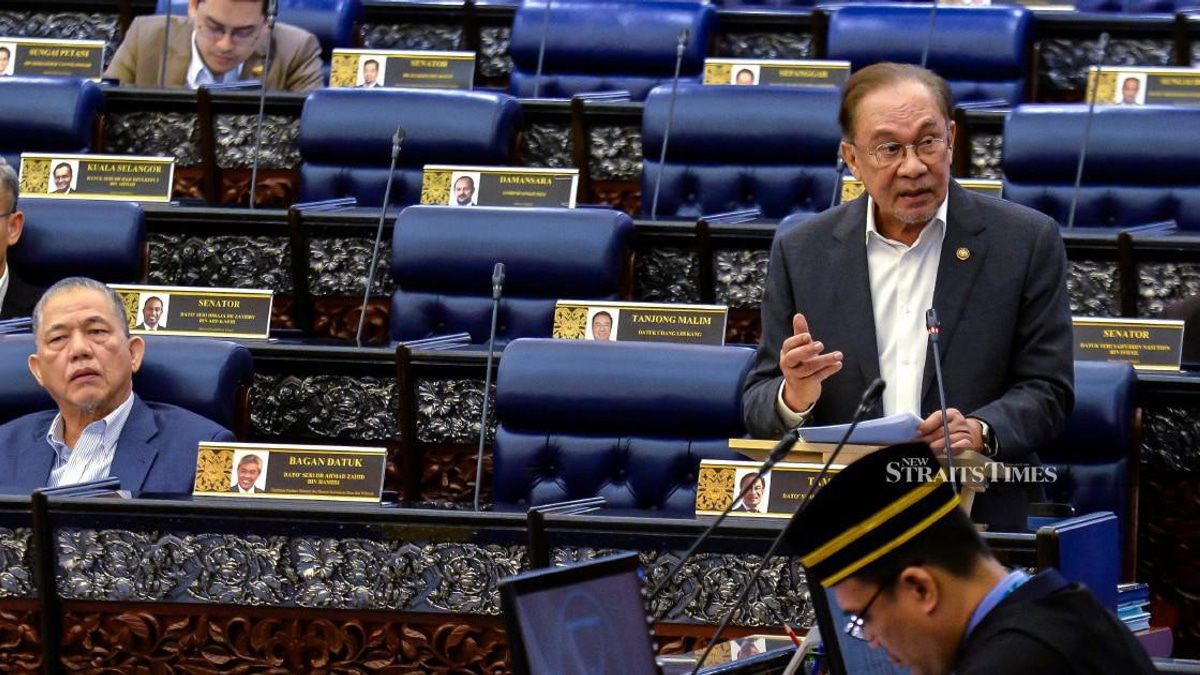 E-wallet firms must compensate scam victims if fraud safeguards fail, says Anwar