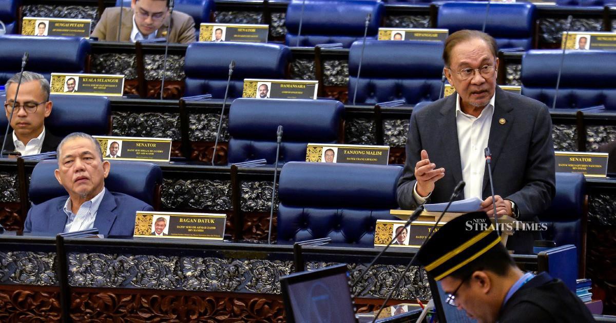 E-wallet firms must compensate scam victims if fraud safeguards fail, says Anwar
